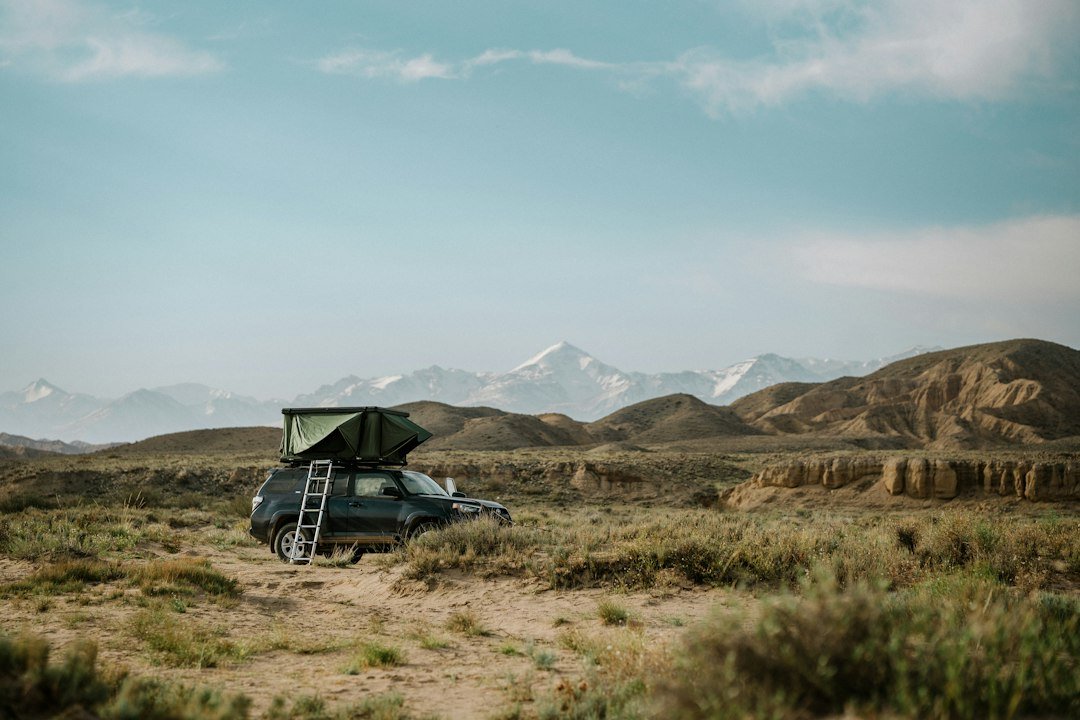 SUV rooftop tent camping landscape